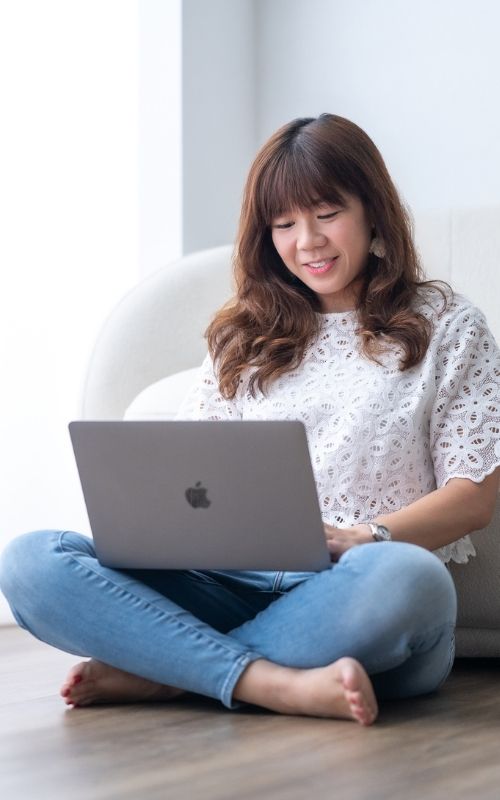 Faith Lee profile pic working on laptop